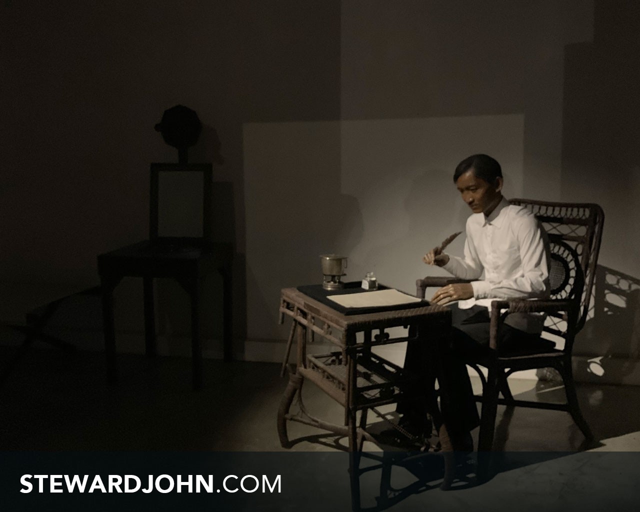 Scene of Jose Rizal writing his memoir